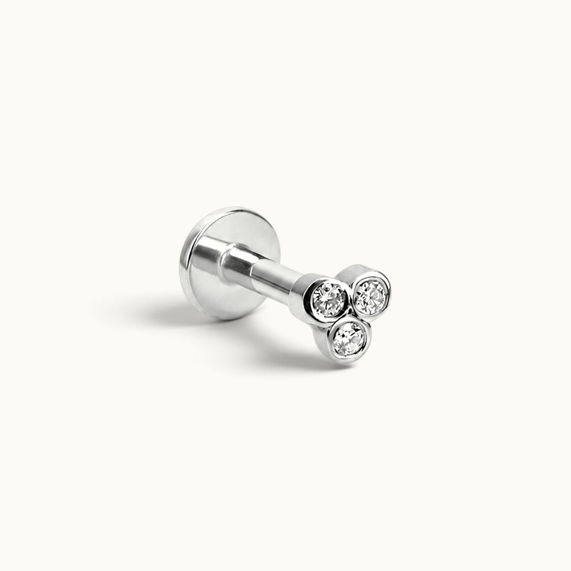 18k gold nose piercing stud with three round diamonds, luxury body jewelry for elegant style