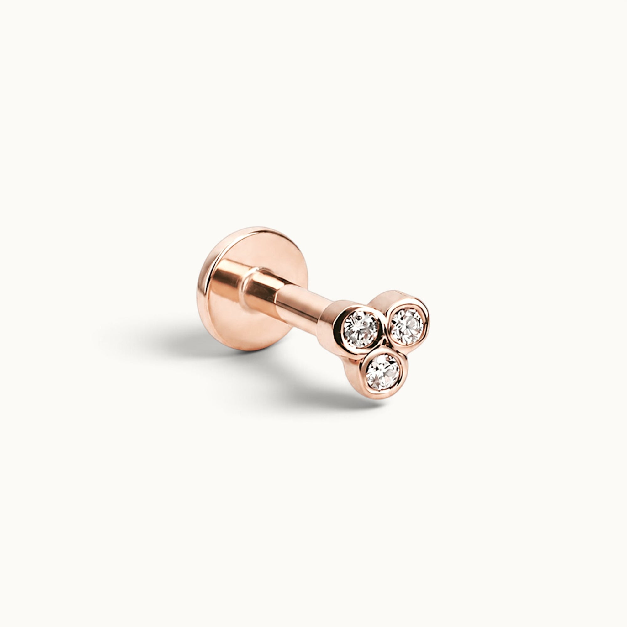 18k rose gold piercing stud with three round diamonds, luxury body jewelry for ear or nose
